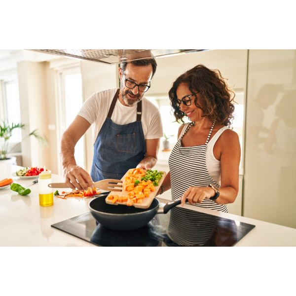 Aged Couple Cooking Vegetables