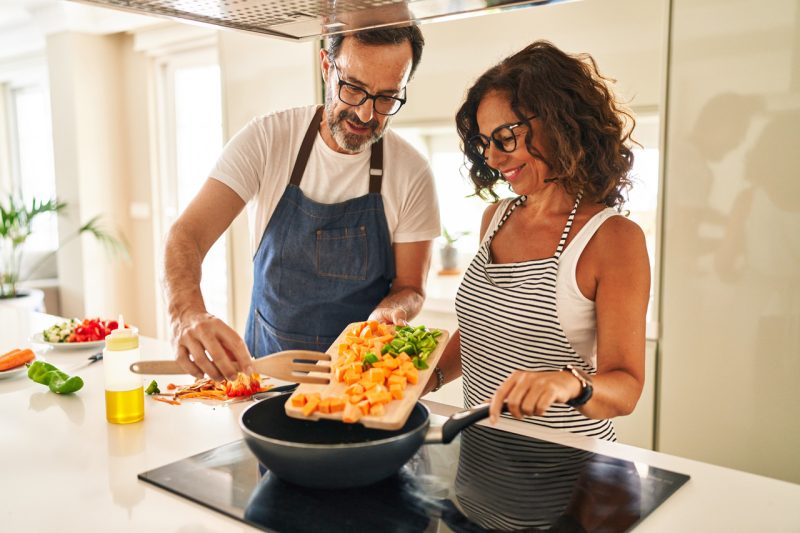 Aged Couple Cooking Vegetables