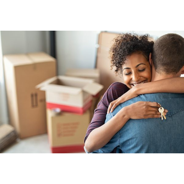 Young Couple Holding the Keys to their New Home