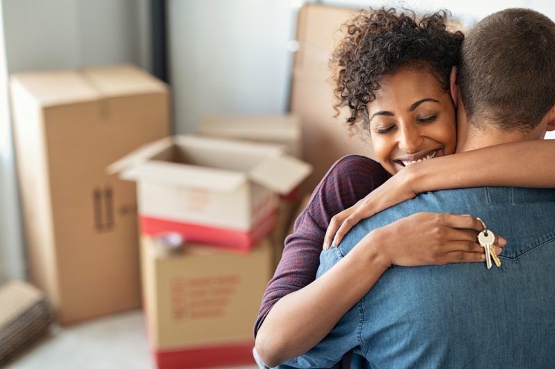 Young Couple Holding the Keys to their New Home