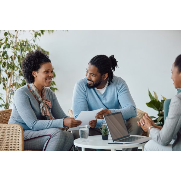 Happy Home Owners Talking with Agent