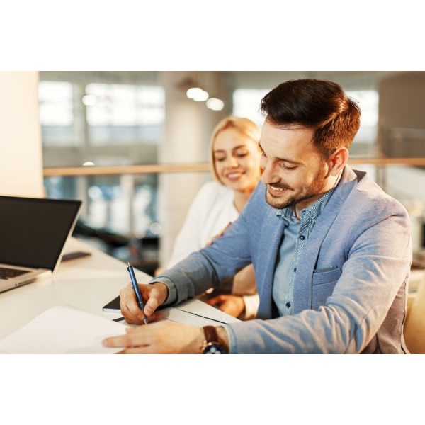 Couple Signing Contract inside an Office Space