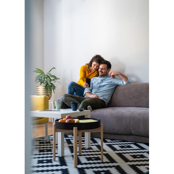 Couple Watching Cellphone in the Livingroom