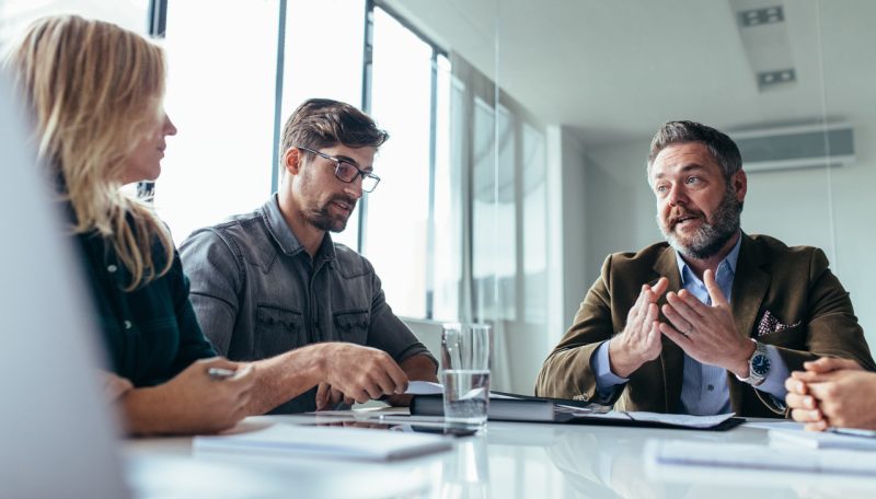 Two Man and Woman in a Meeting