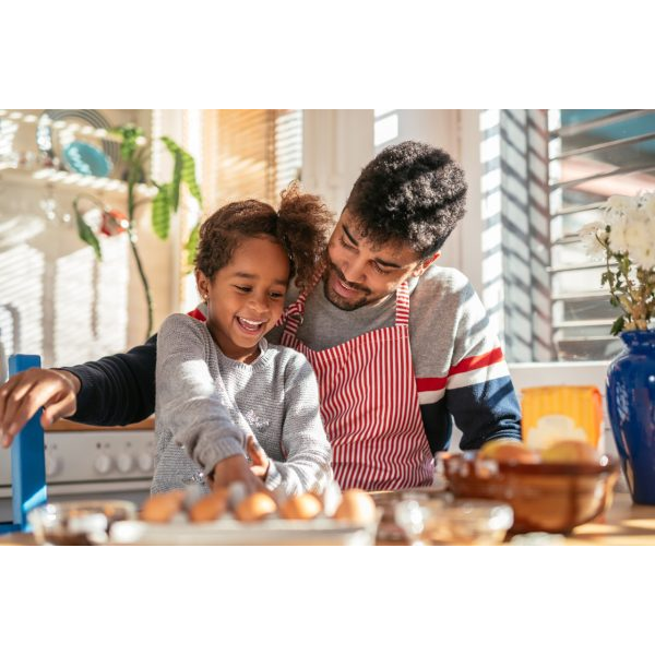 Happy Father and Daughter Baking in the Kitchen