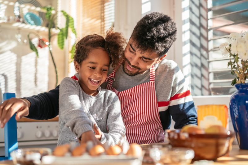 Happy Father and Daughter Baking in the Kitchen