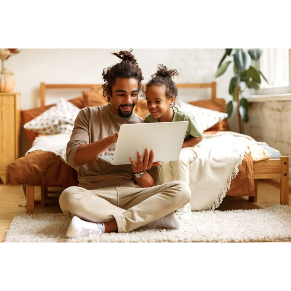 Young Father and Daughter with Laptop