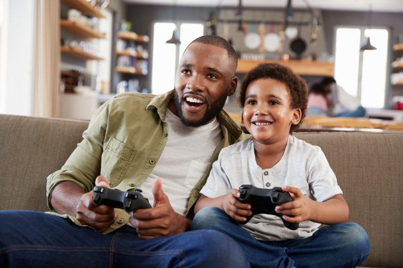 Young Father and Son Playing Video Games