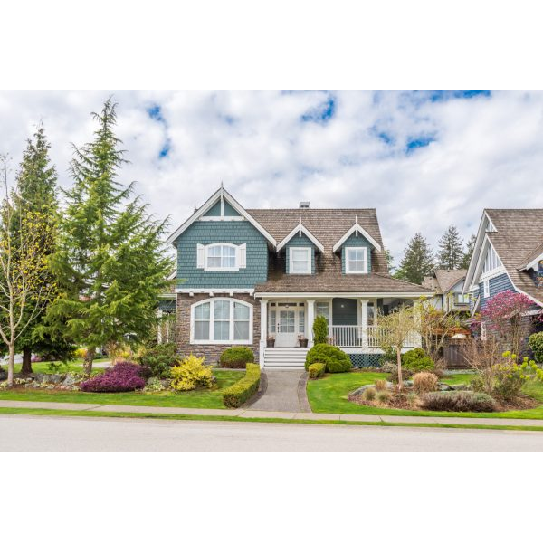 Beautiful House in the Suburbs with Trees and Small Lawn