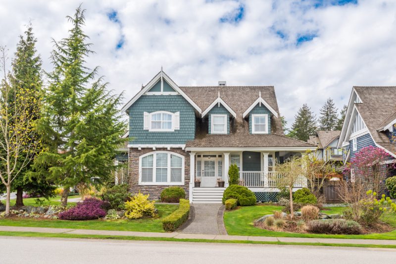 Beautiful House in the Suburbs with Trees and Small Lawn