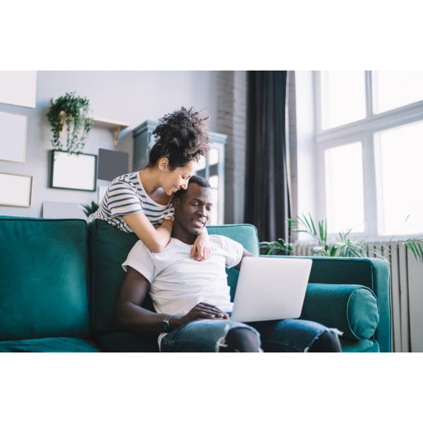 Happy Couple Watching a Laptop