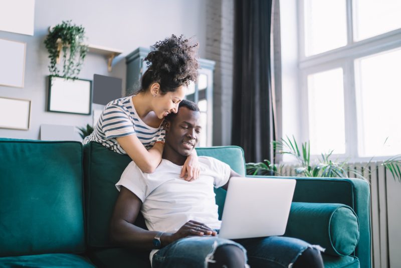 Happy Couple Watching a Laptop