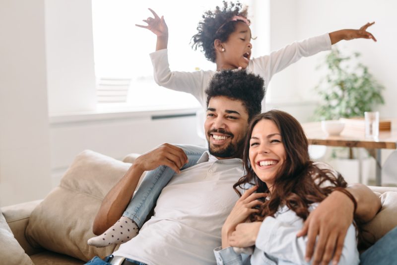 Mother, Father and Daughter Sharing Happy Time