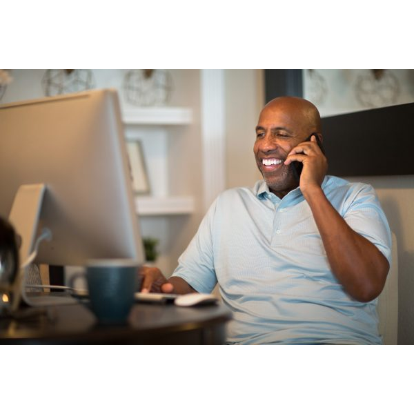 Happy Man on the Phone with Computer