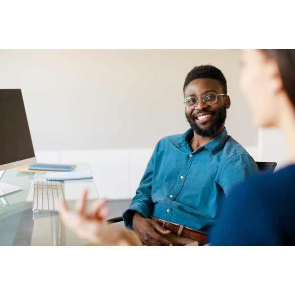 Man Smiling Working with Computer