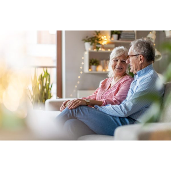 Happy Old Couple in the Living Room