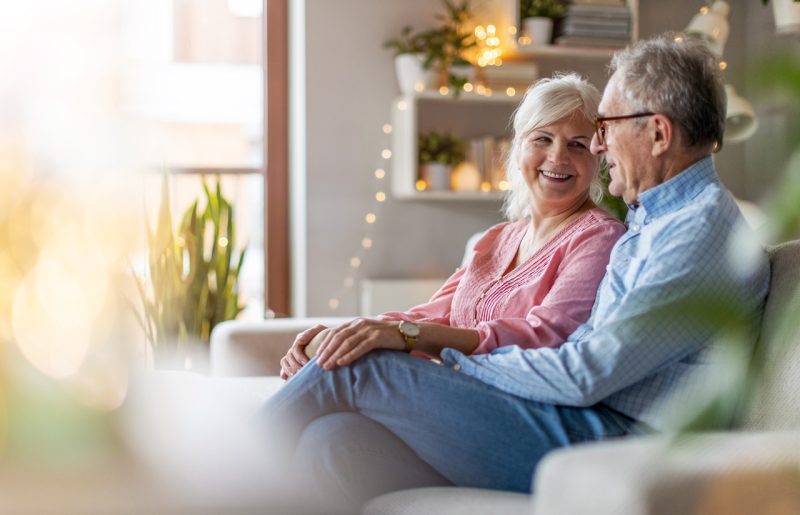 Happy Old Couple in the Living Room