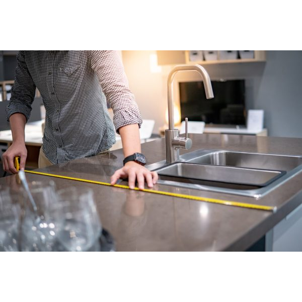 Man Measuring the Kitchen