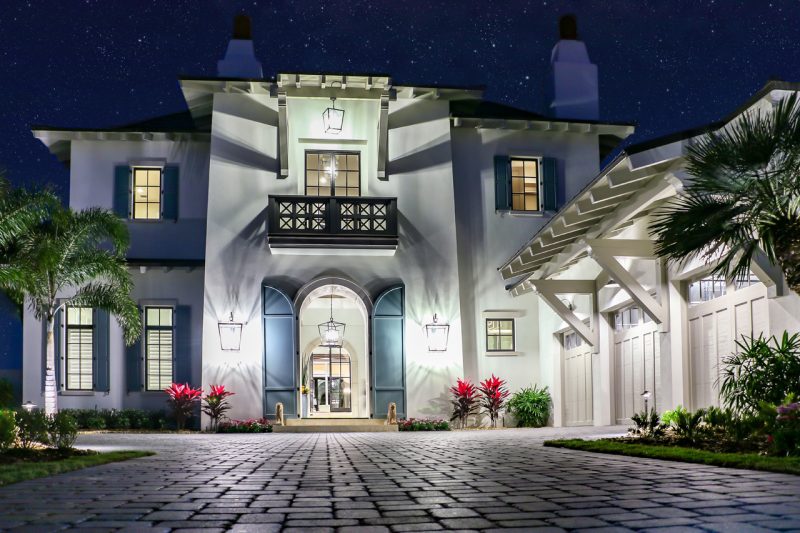 Luxury House with Open Doors at Night