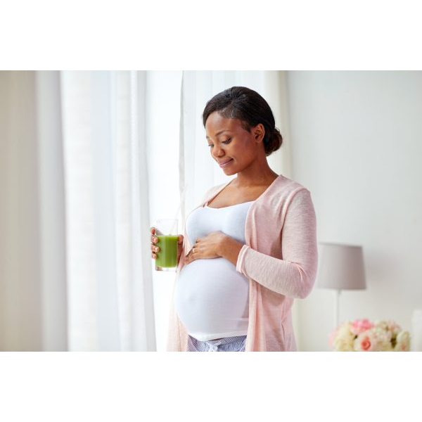 Pregnant Young Woman Drinking Green Juice