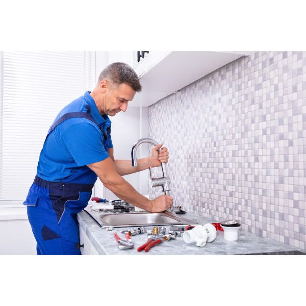 Man Repairing the Sink