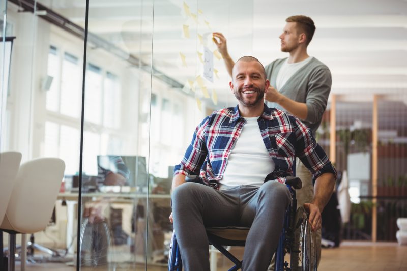 Man in a Wheelchair inside an Office