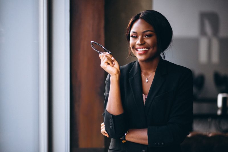 Woman Broker with Glasses in Hand