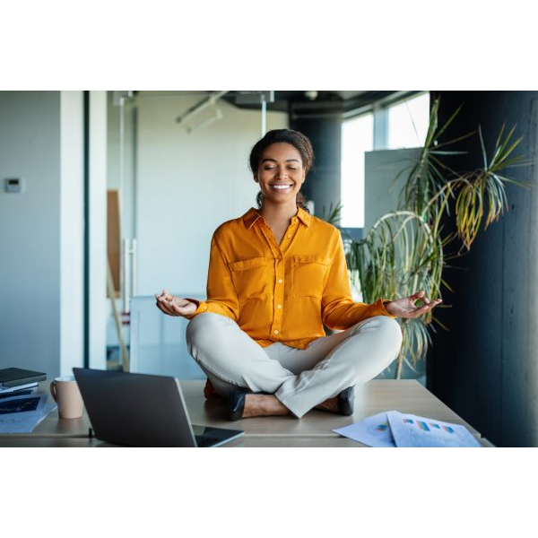 Young Woman Meditating in Her Office