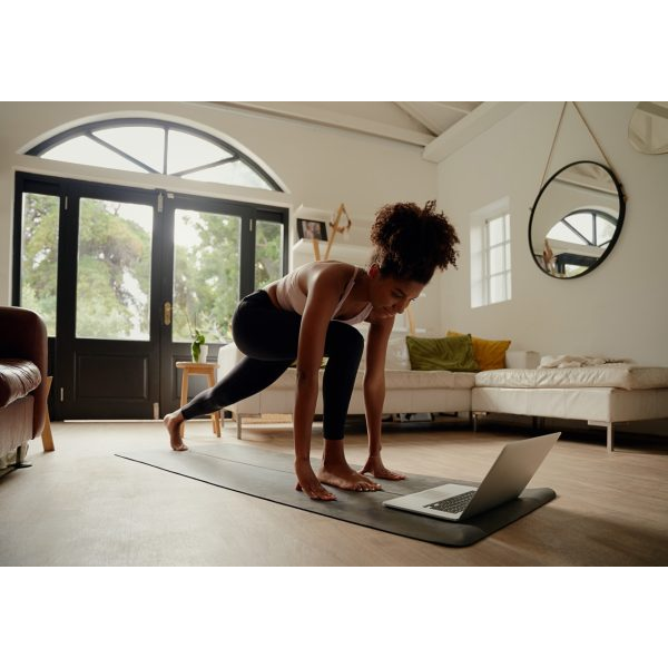 Woman Practicing Yoga at Home