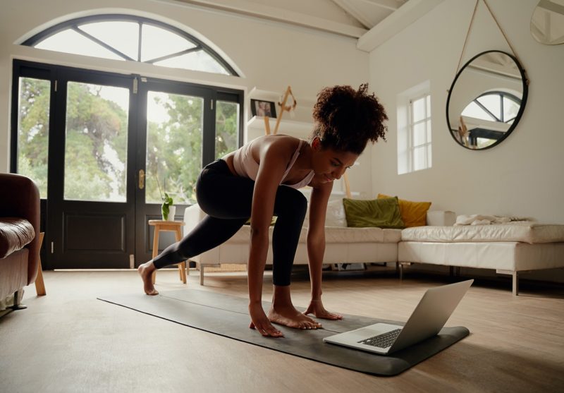 Woman Practicing Yoga at Home