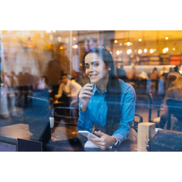 Woman Working inside a Coffee Place