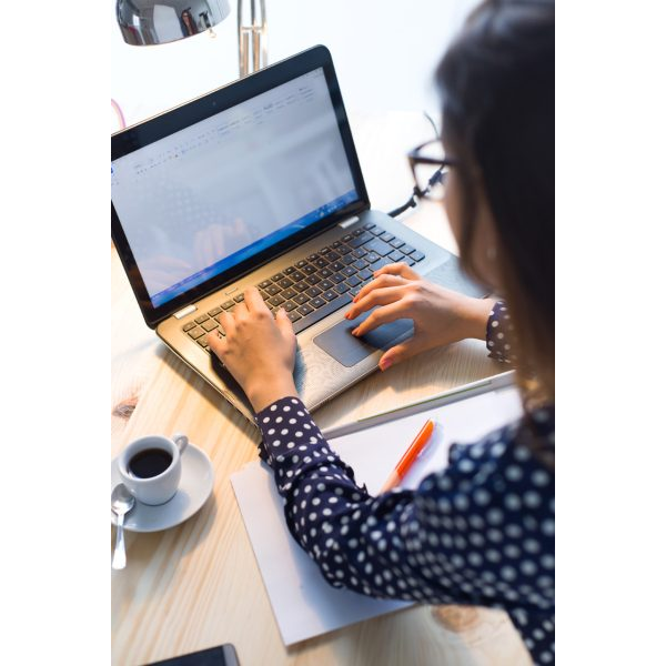 Top View of Woman Working in a Laptop