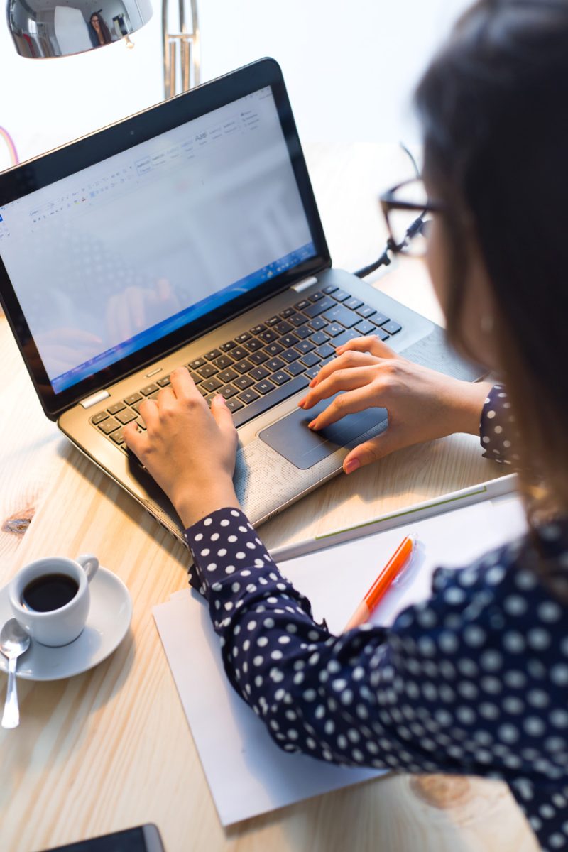 Top View of Woman Working in a Laptop