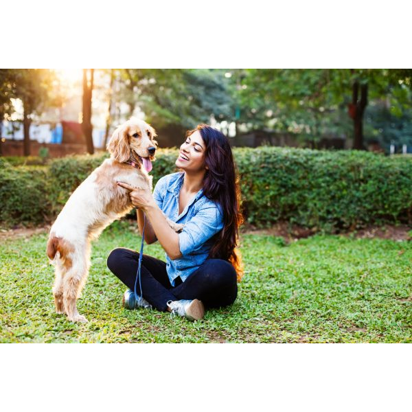 Young Woman with Long Hair and Cocker Spaniel