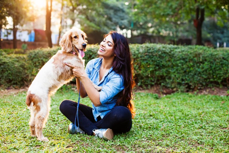 Young Woman with Long Hair and Cocker Spaniel