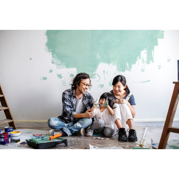 Young Family Painting a Room