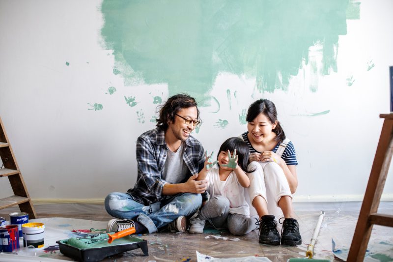 Young Family Painting a Room