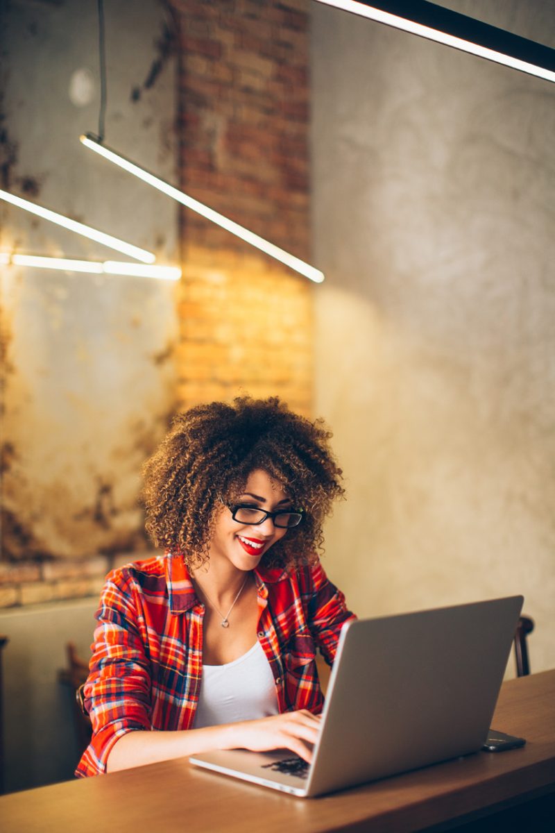 Young Woman Working on Laptop